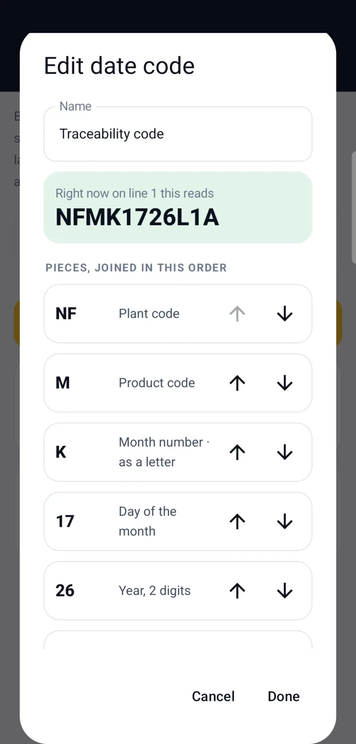 A traceability code built from pieces: plant code NF, product code M, October as the letter K, day 17, year 26 and line code L1A, reading NFMK1726L1A right now